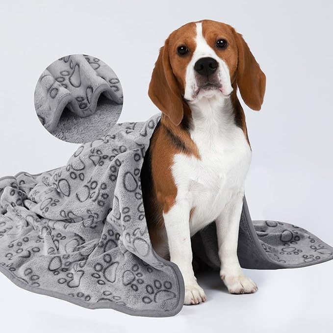 Folded fleece pet blanket with paw-print pattern